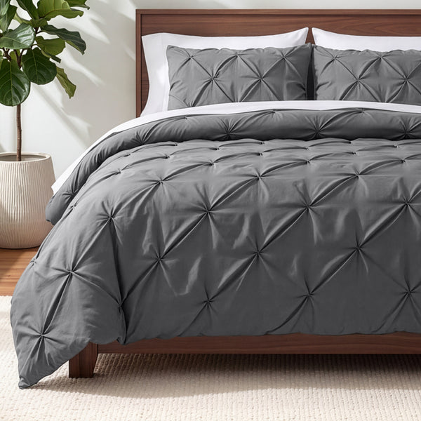 Gray pintuck comforter on a bed