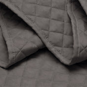 Close in view showing texture of coverlet set fabric