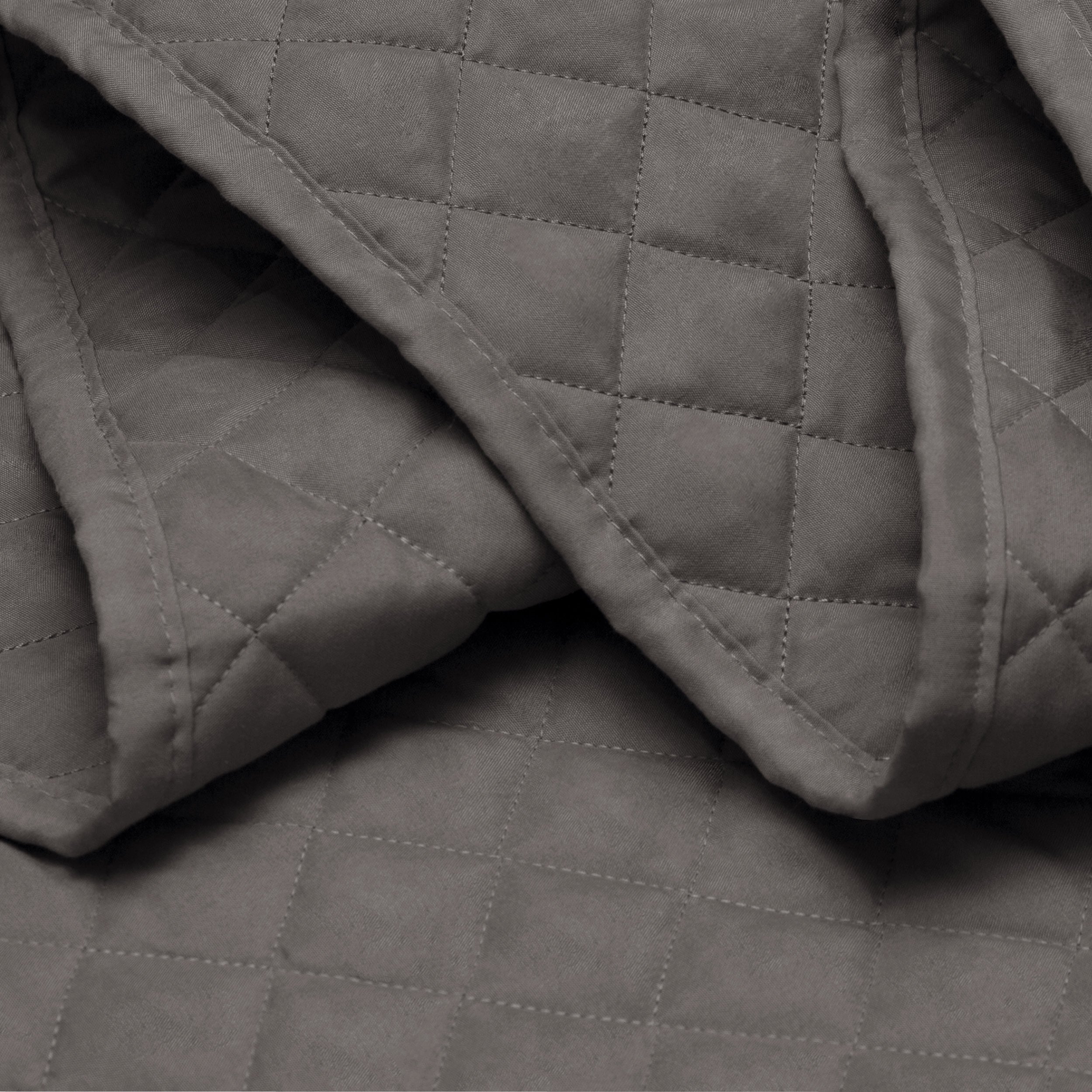 Close in view showing texture of coverlet set fabric