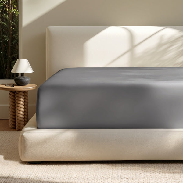A deep pocket mattress with a fitted sheet on it