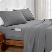 Bed made with a fitted sheet which has pockets on the side