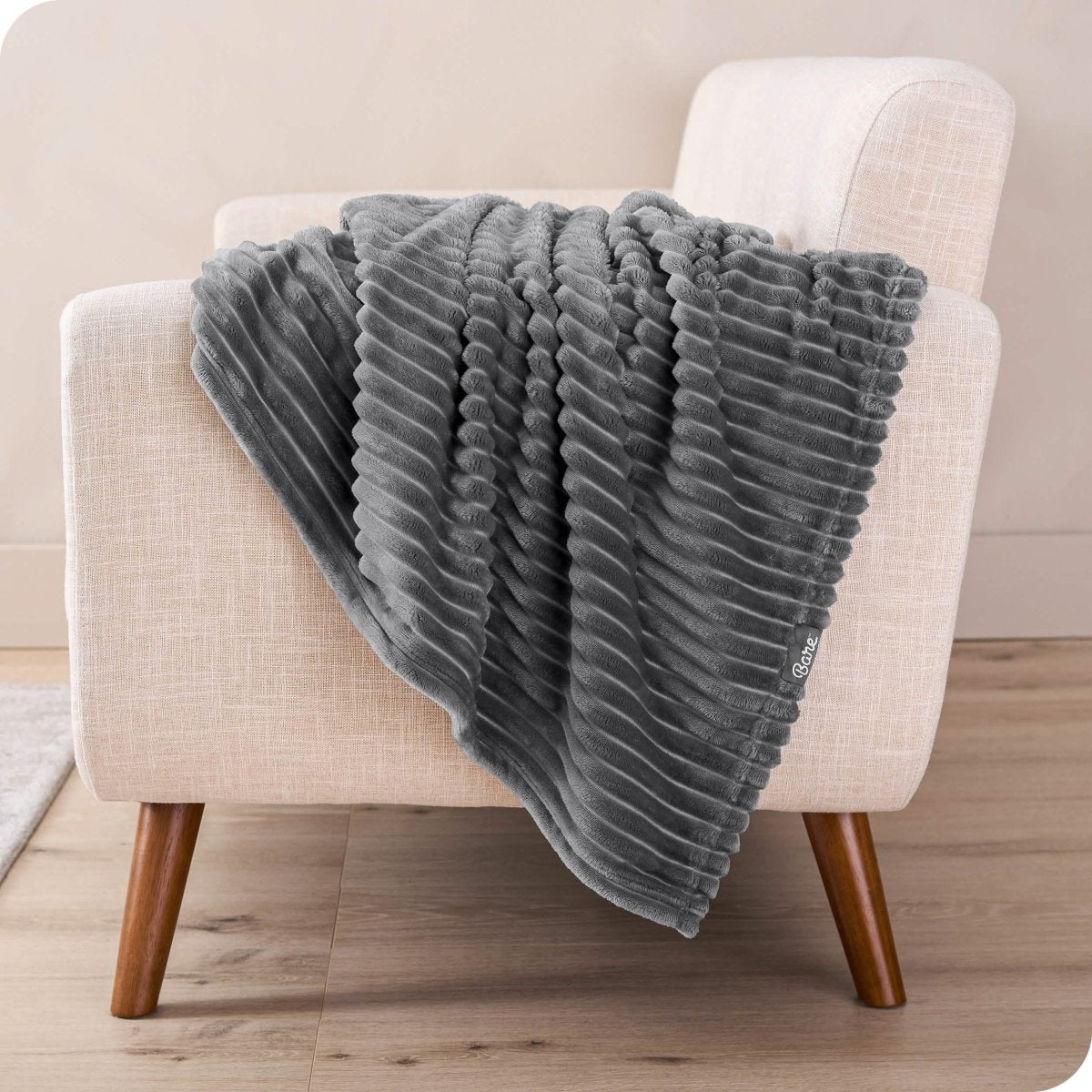 A microplush blanket draped over a chair