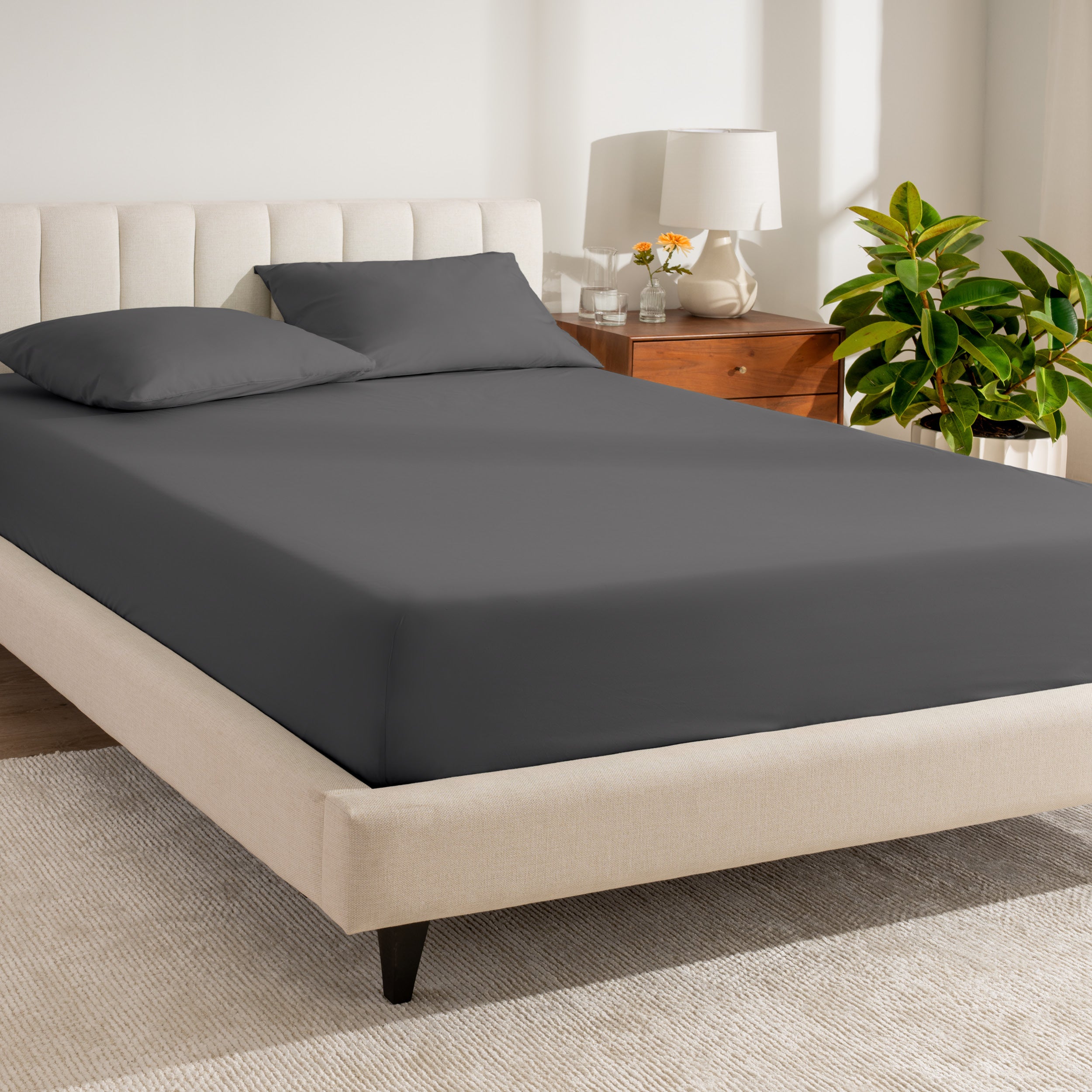 A bed made with a percale fitted sheet