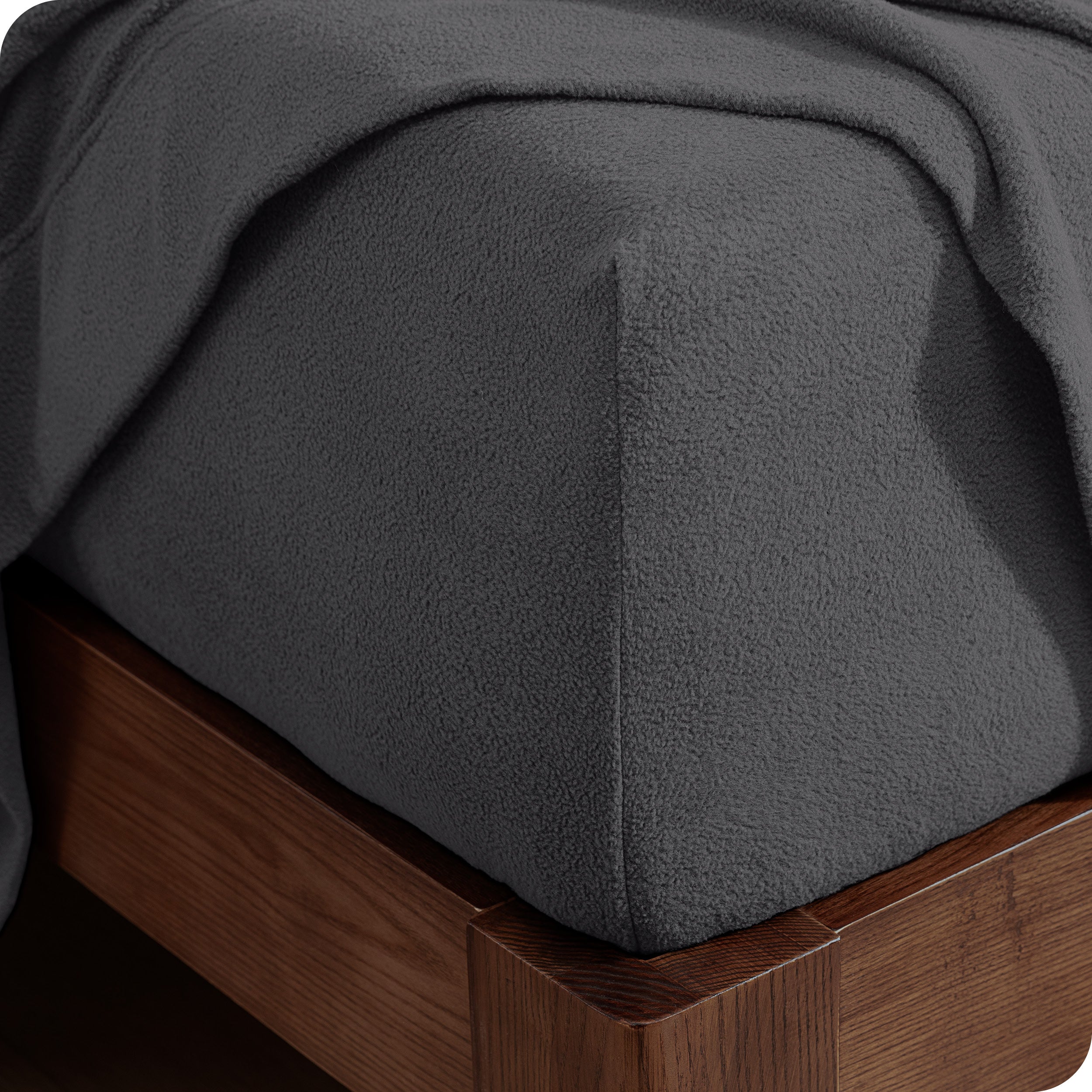 Fitted sheet on a wooden bed frame