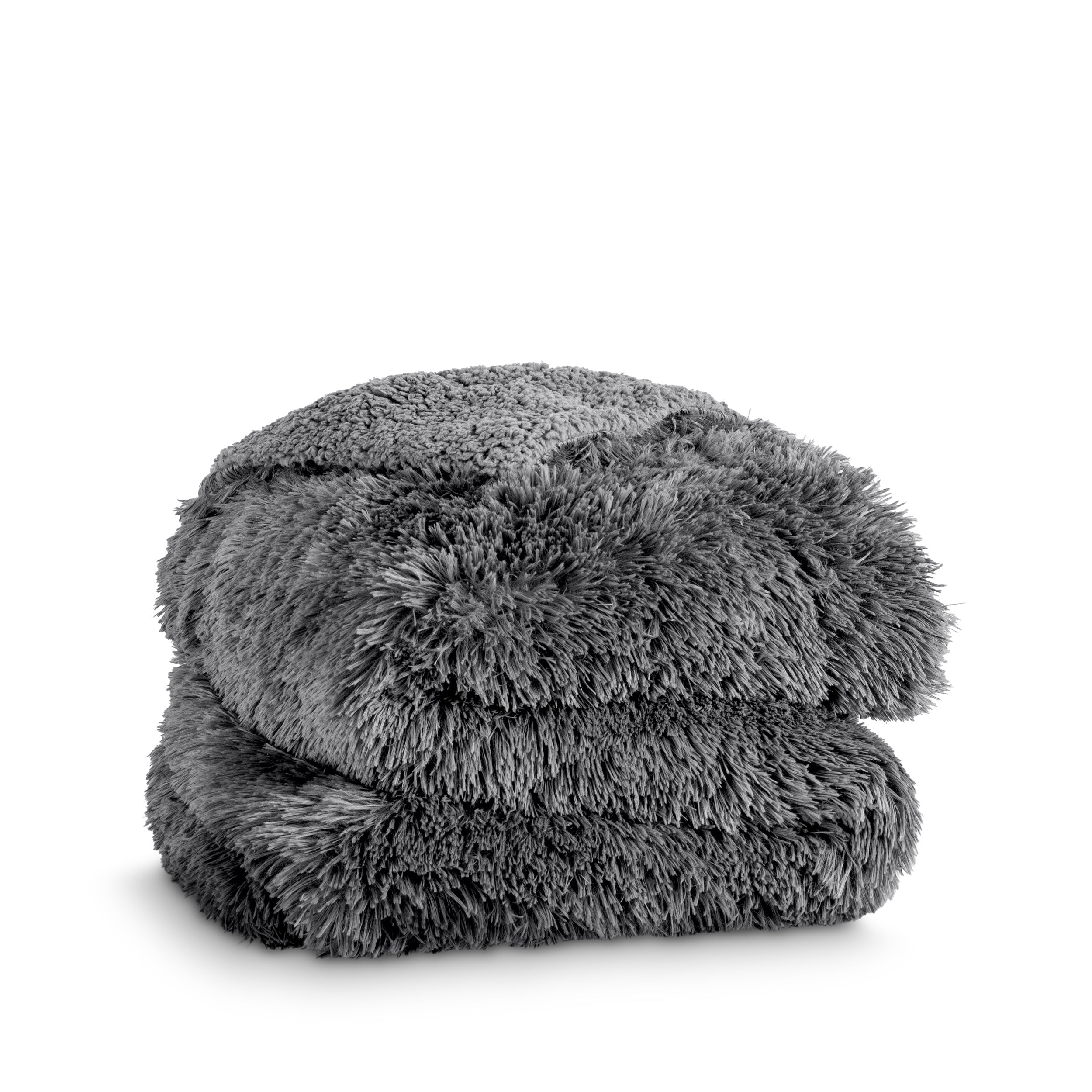 A shaggy faux fur blanket folded