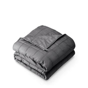 A folded cotton weighted blanket with a white background