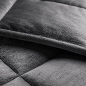 Close-up of a weighted blanket showing the stitching and texture