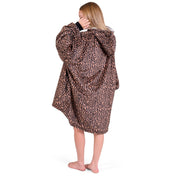 Person wearing a hooded blanket on a white background