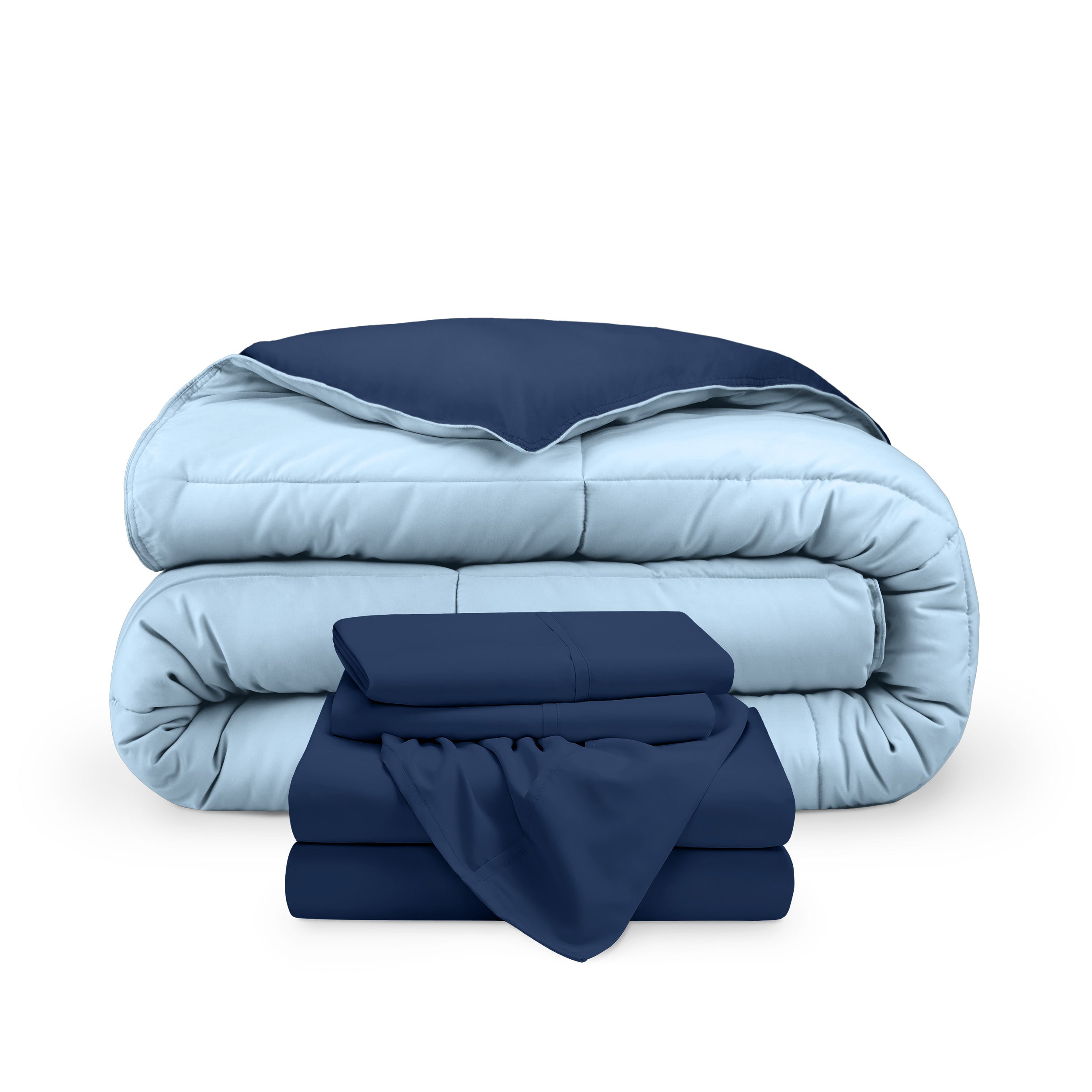 A reversible microfiber comforter and a coordinating sheet set folded and stacked