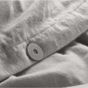 Close up of the button closure on a flannel duvet cover