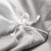 Close-up of the ties on a flannel duvet cover