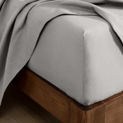 Flannel fitted sheet on a wooden bed frame