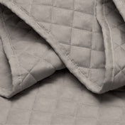 Close in view showing texture of coverlet set fabric