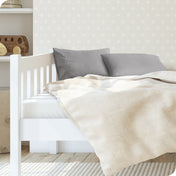 A toddler's bed with 2 microfiber pillowcases on pillows