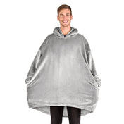 A man standing with a wearable blanket on