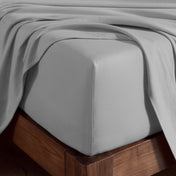 Organic cotton jersey sheet set on a wooden bed frame