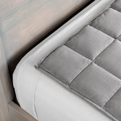 Close-up of a weighted blanket on a bed