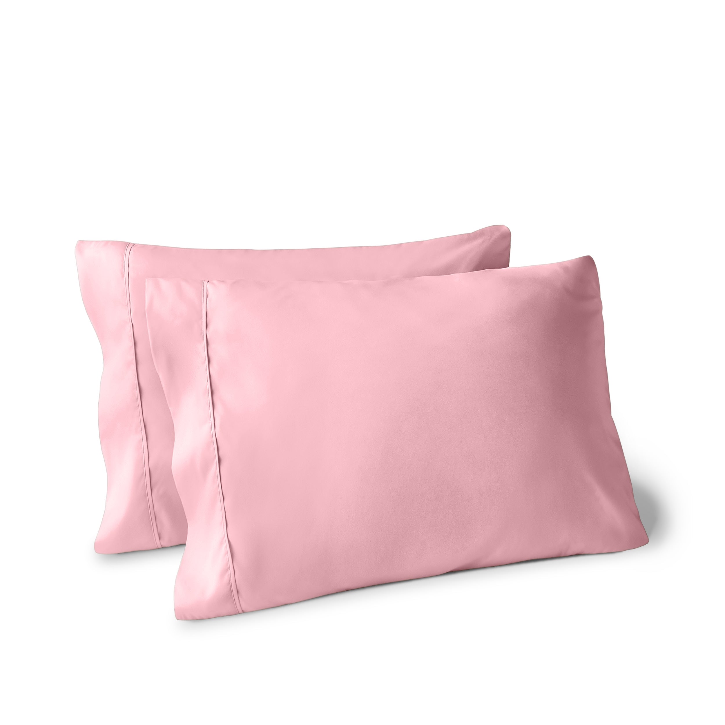 Two pillows on a white background with pillowcases on them
