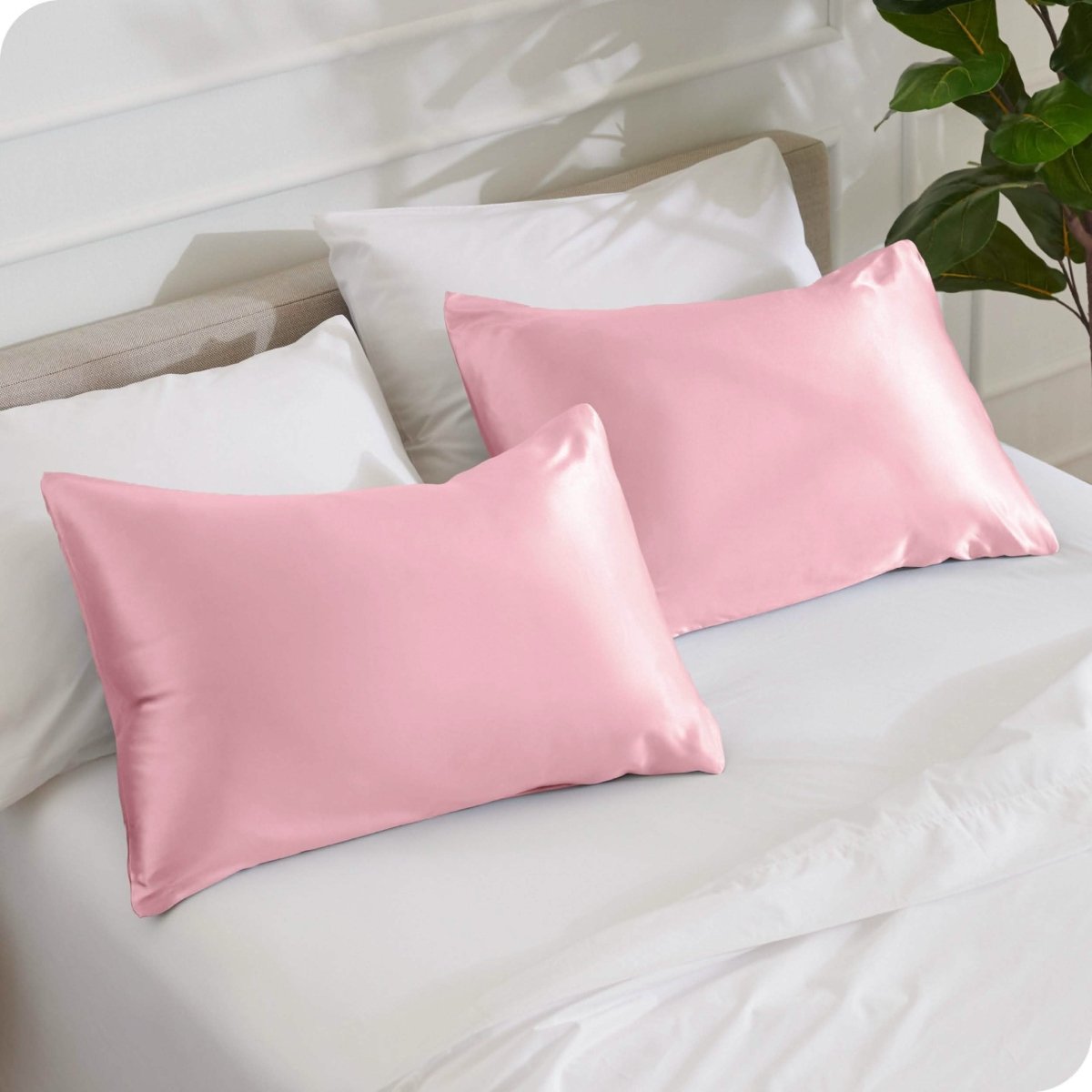 2 mulberry silk pillowcases on pillows set on a bed