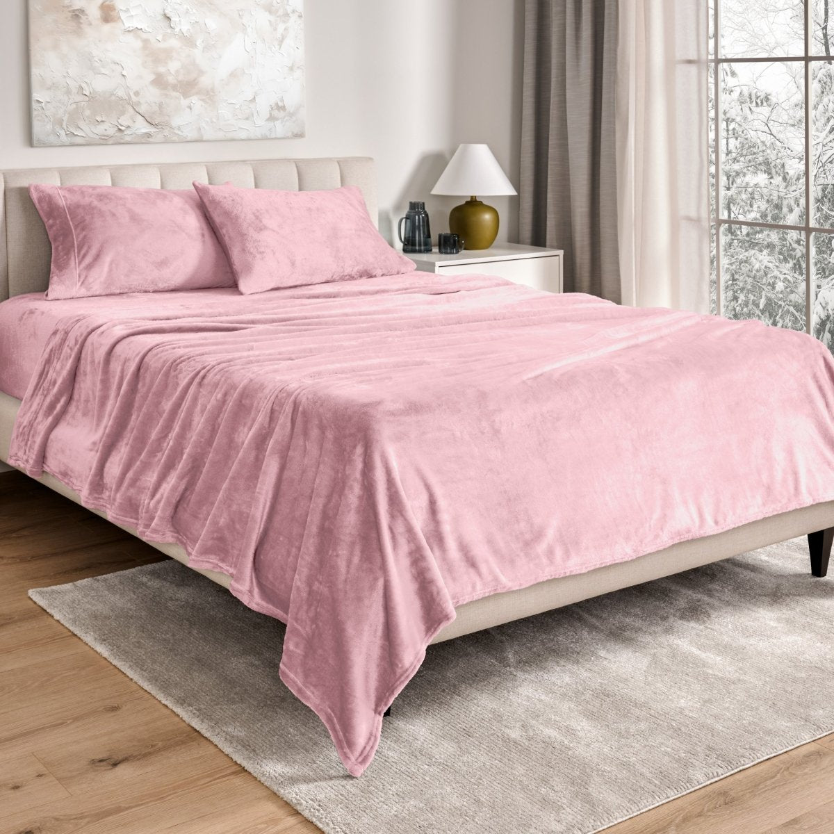 Neatly made bed in a well-lit bedroom.