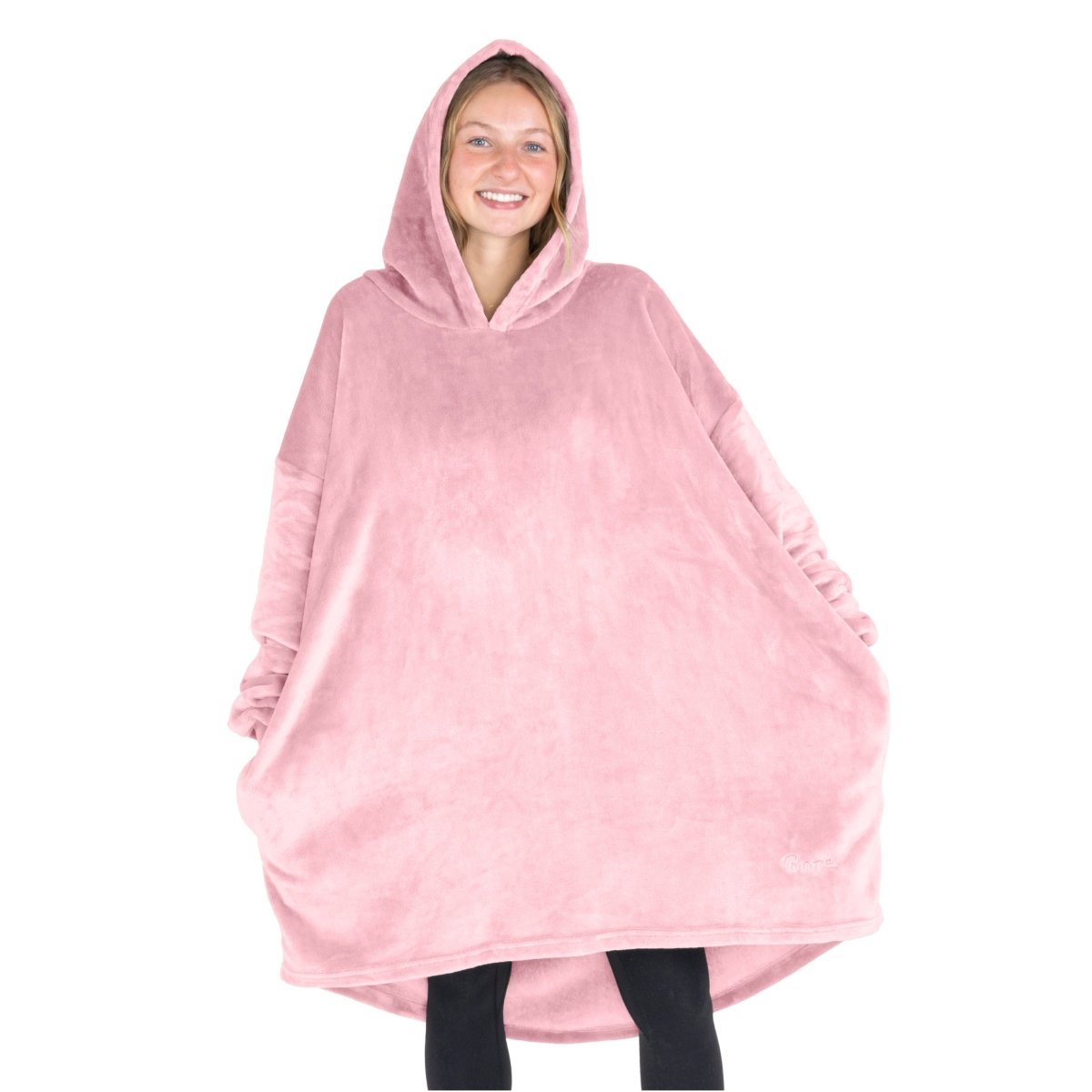 A woman wearing a cozy hooded blanket