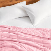 Close-up of a minky weighted blanket on a bed