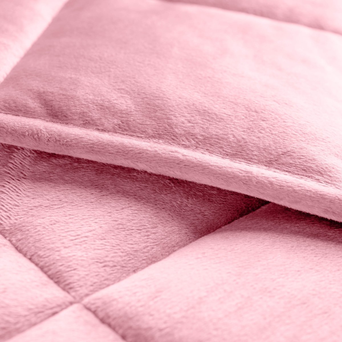 Close-up of a weighted blanket showing the stitching and texture