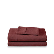 Set of bed sheets folded on a white background