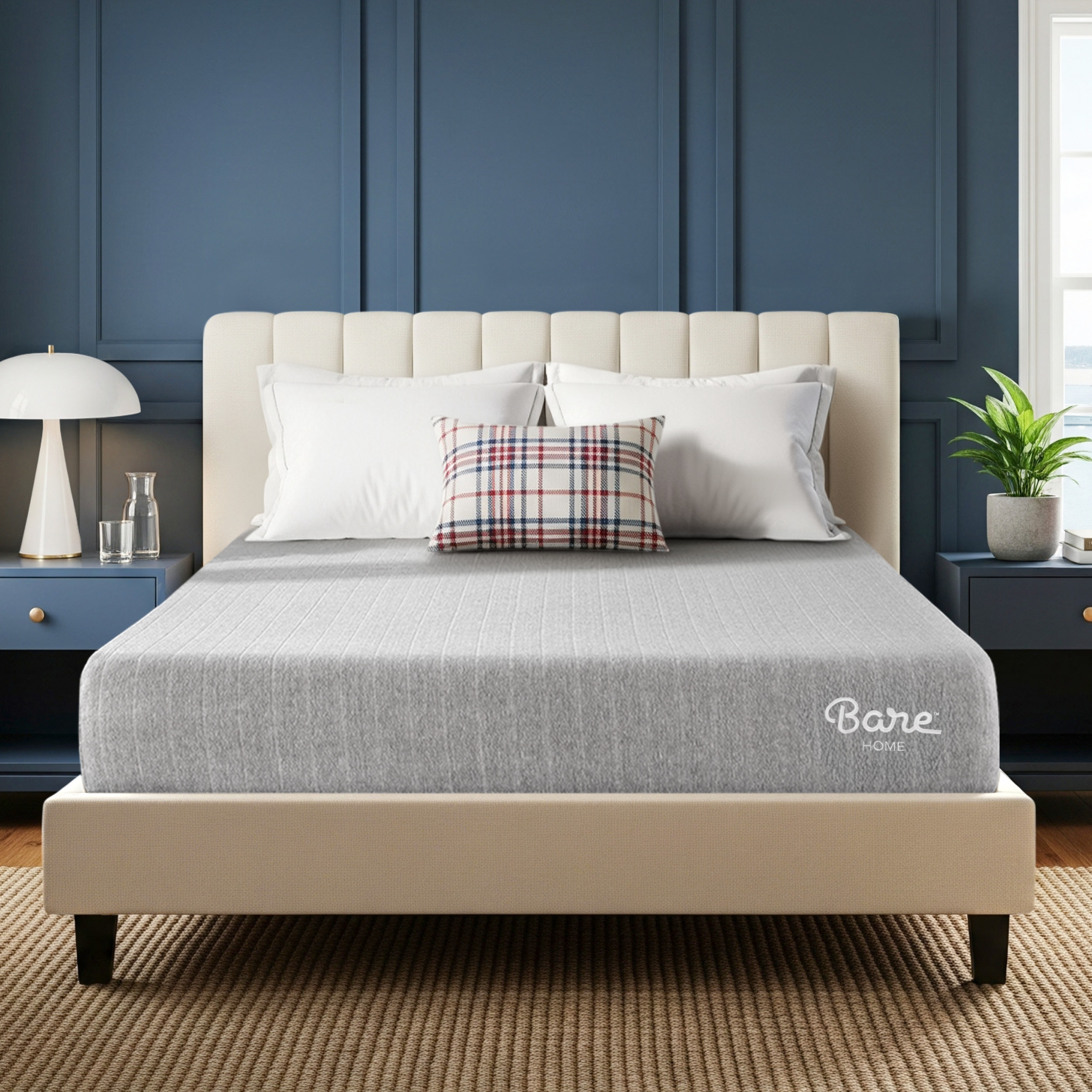 Beige bed frame with gray mattress cover in a bedroom setting