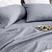 Bedding set on a bed with a bowl of cereal on a white background