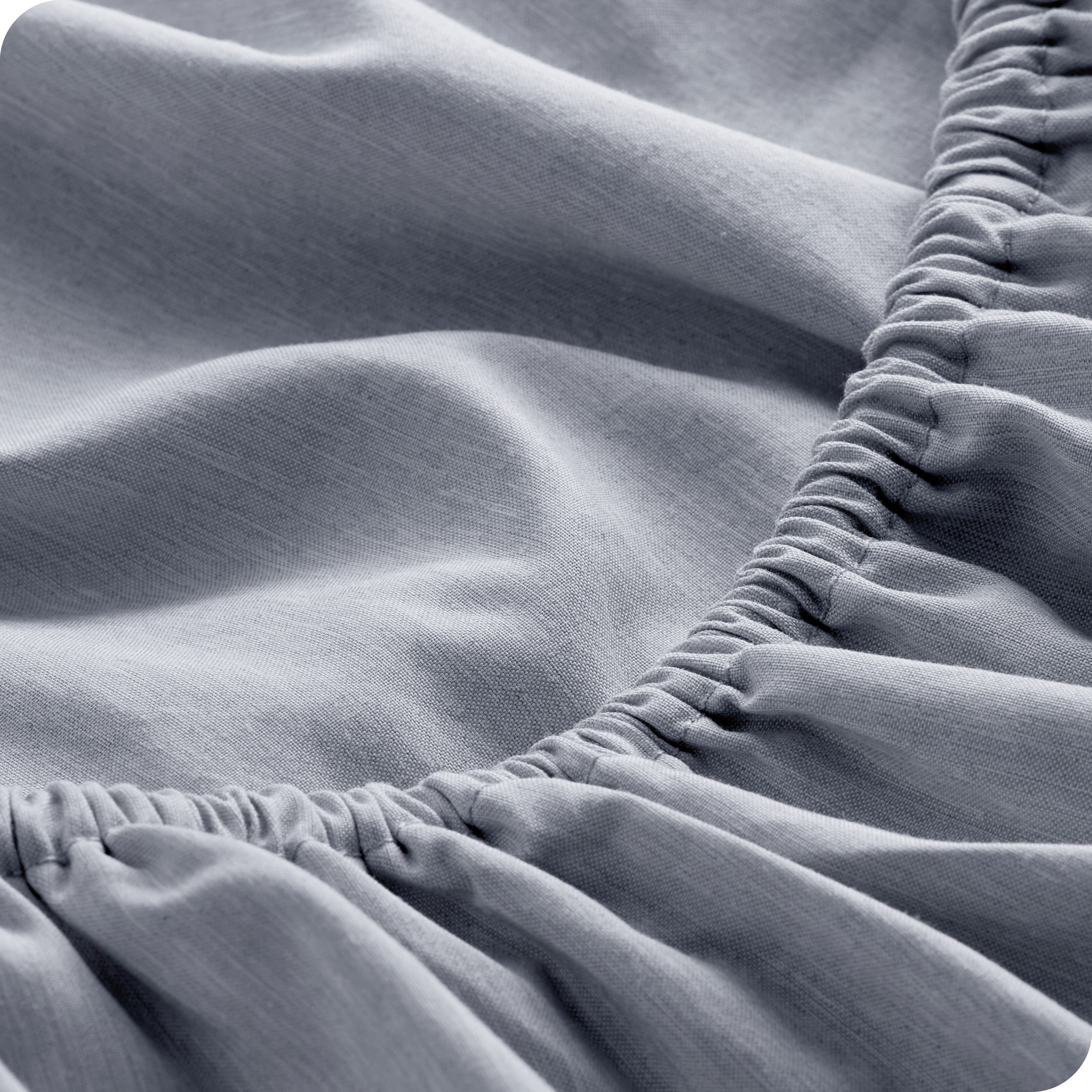 Close-up of fitted sheet with elastic edge