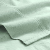 Close-up of flannel fabric with a focus on texture and color.