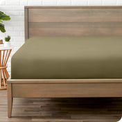 A mattress with just a fitted sheet on it