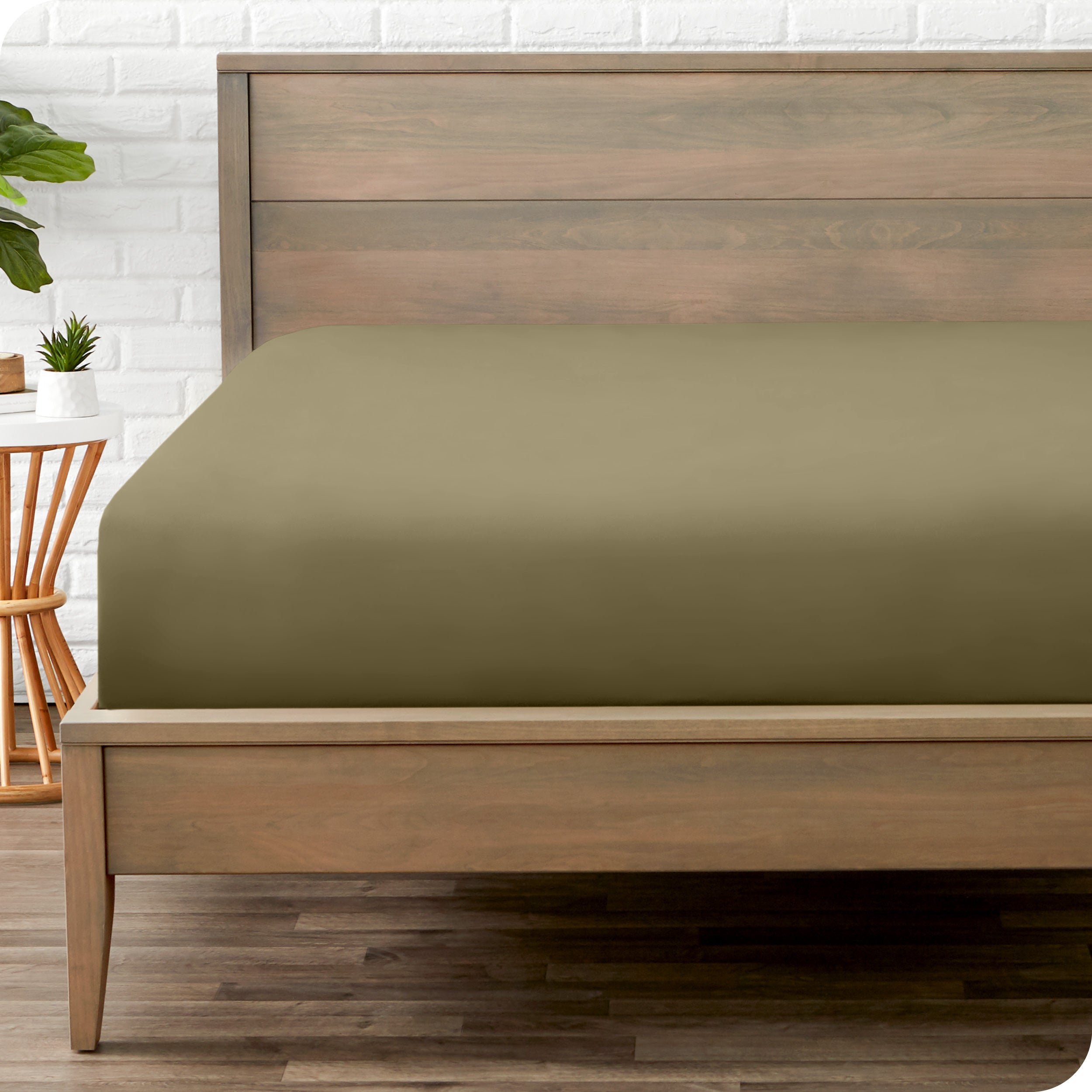 A mattress with just a fitted sheet on it