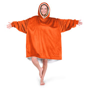An adult with a sherpa wearable blanket on