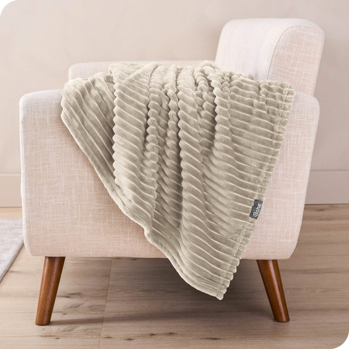A microplush blanket draped over a chair