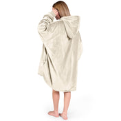 An adult with a hooded wearable blanket on