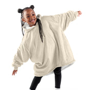 A child with a wearable blanket on