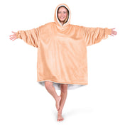 An adult with a sherpa wearable blanket on