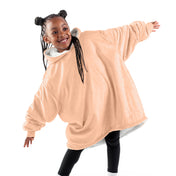 A child with a wearable blanket on