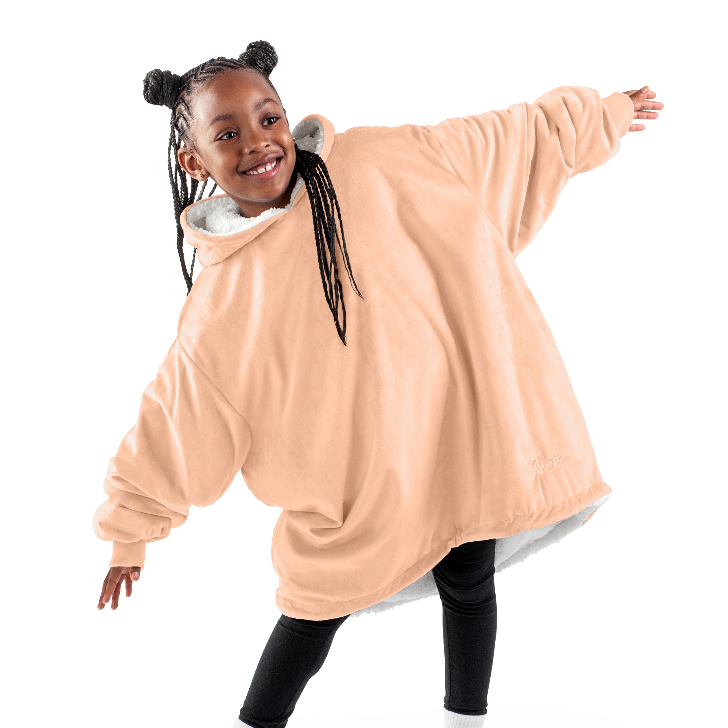 A child with a wearable blanket on