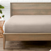 A mattress with just a fitted sheet on it