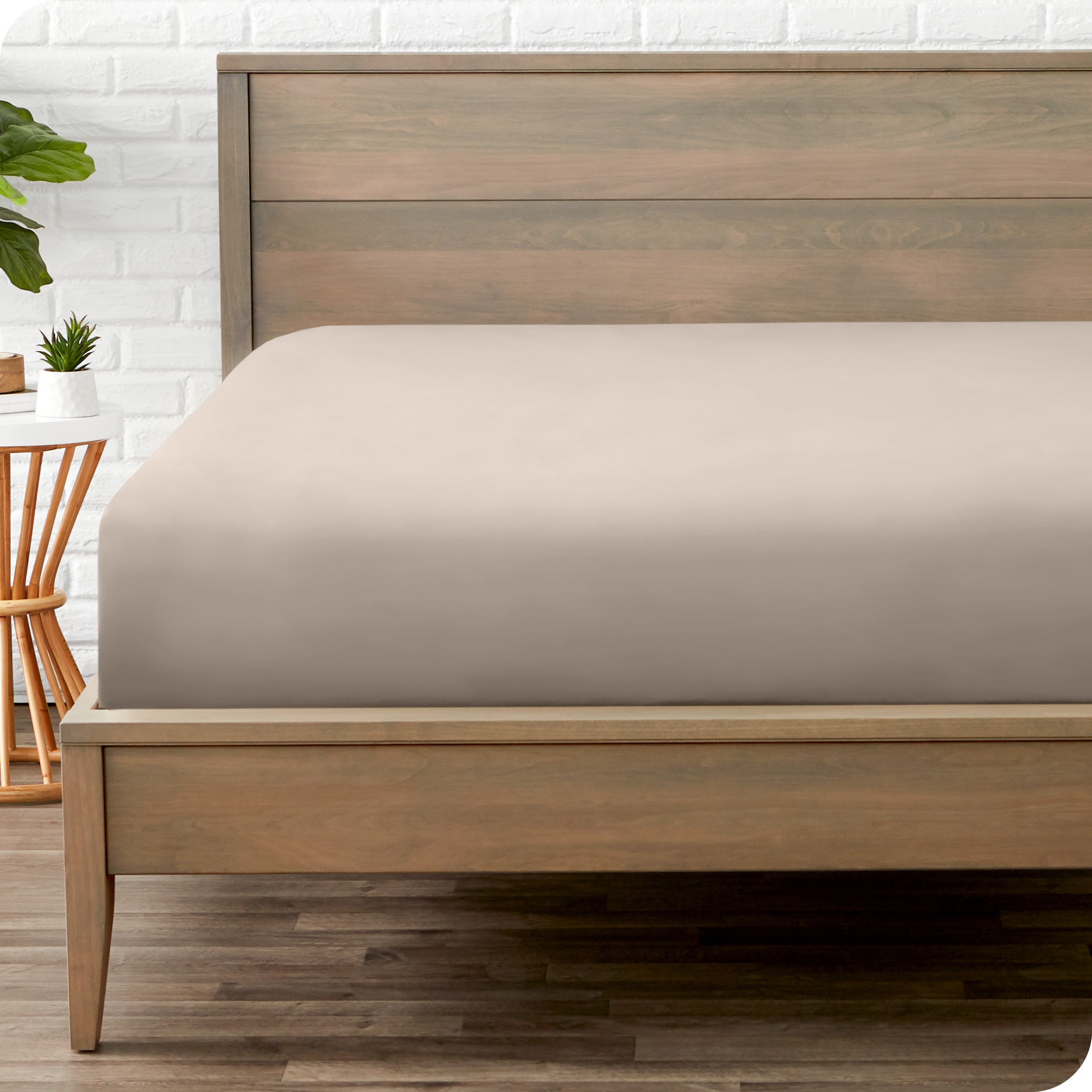 A mattress with just a fitted sheet on it