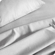 Close up of a heather sheet set on a bed