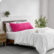 A body pillowcase on a pillow on a bed in a modern bedroom