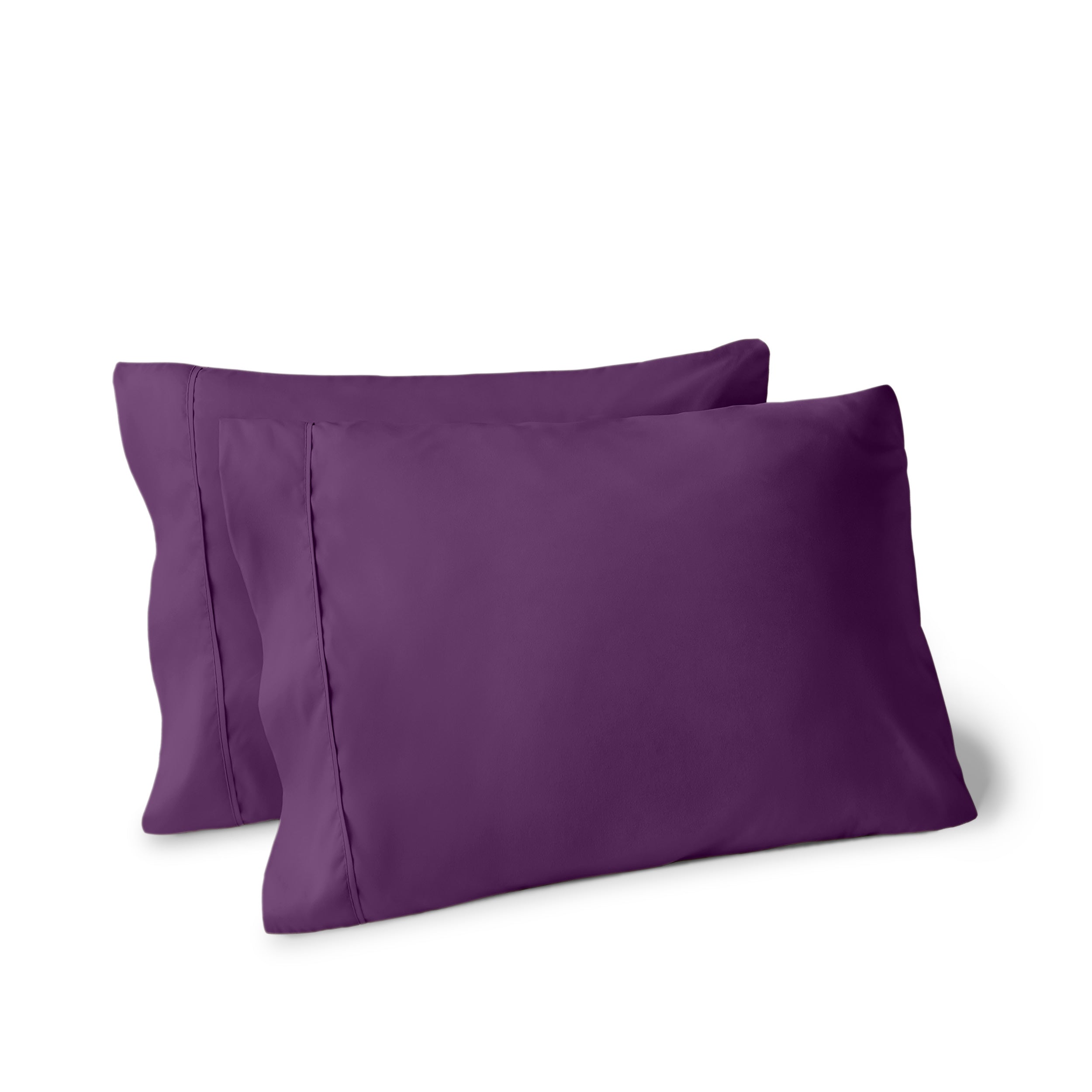 Two pillows on a white background with pillowcases on them