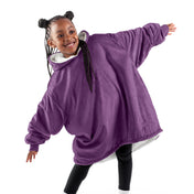A child with a wearable blanket on