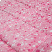 Close-up image of a weighted blanket, featuring detailed stitching and the neatly finished edge of the blanket.