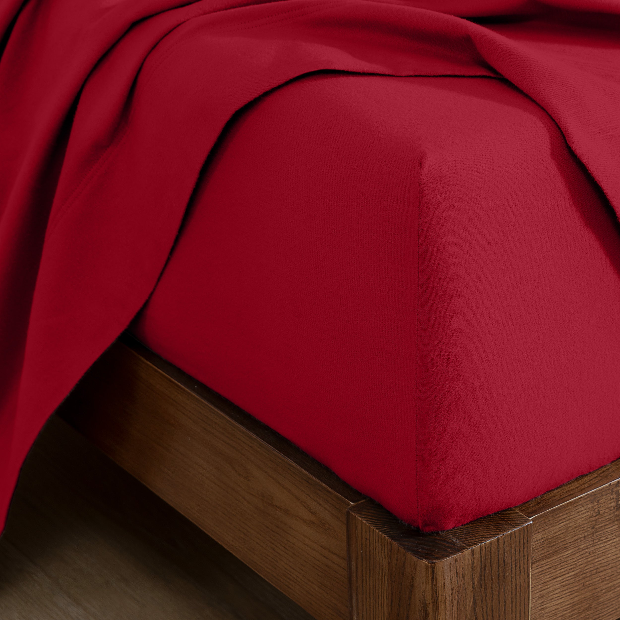 Flannel fitted sheet on a wooden bed frame
