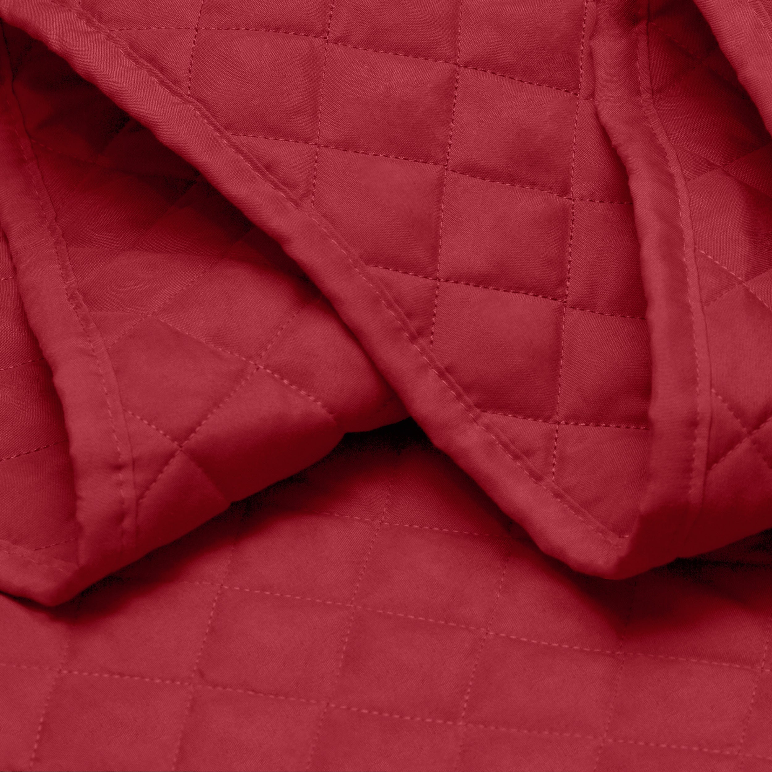 Close in view showing texture of coverlet set fabric